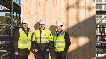 The team were onsite to see the first panels land on site.(l-r) Charles Northcote (BlueCHP Limited), Adam Strong (Strongbuild), Marcelo Steimbeisser (BlueCHP Limited).