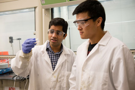 Srikanth Pilla, left, works with a graduate student in their lab.