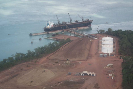 Photo: Woodchips are loaded onto a ship at Port Melville, bound for Japan. (ABC Rural: Lisa Herbert) 